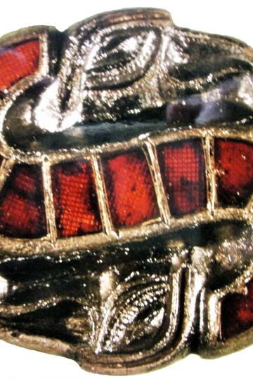 Zu sehen ist die S-Fibel aus dem Grab von "Auija". 