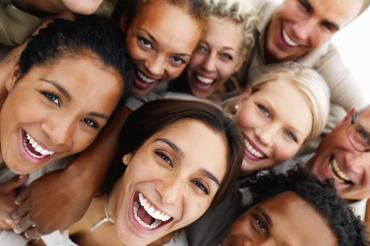 Portrait of business colleagues holding each other and laughing