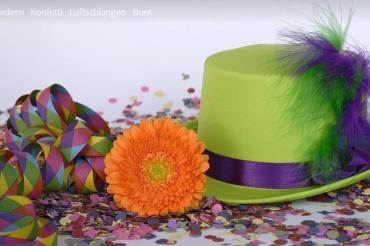 Das Bild zeigt Luftschlangen und einen Faschingshut.