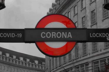 Das Bild zeigt ein Corona Stoppschild.