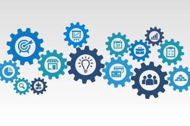 Das Bild zeigt Zahnräder die verschiedenen Faktoren entsprechen.