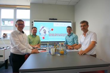 Landrat Stefan Rößle (vorne links), Oberbürgermeister David Wittner (hinten rechts),  Prof. Dr. Thomas Kirchmeier (hinten links) und Josef Wolf (vorne rechts)