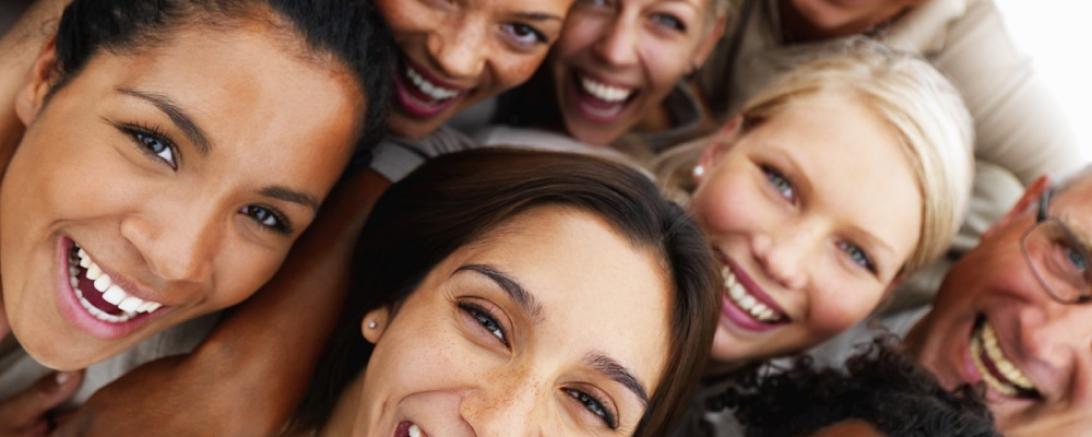 Portrait of business colleagues holding each other and laughing