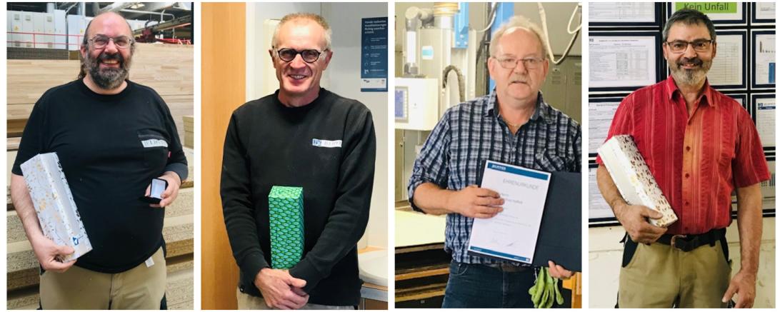 Das Bild zeigt die geehrten Mitarbeiter. 