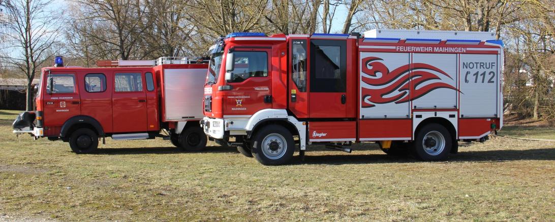 Es sind zwei Feuerwehrautos zu sehen.