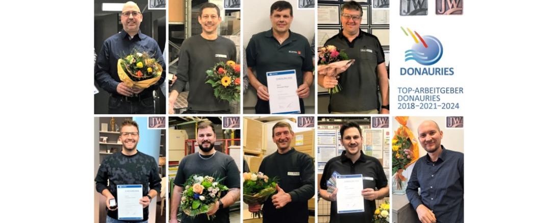 Die stolzen Mitarbeiter bei der Ehrung.