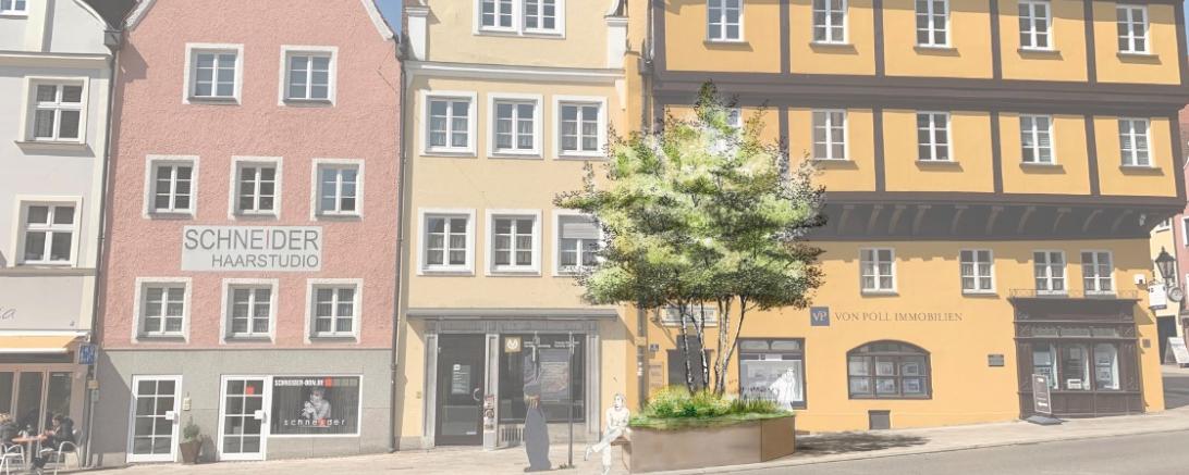 In der Spitalstraße wird in Baum in einem Hochbeet mit integrierten Sitzmöglichkeiten gepflanzt.