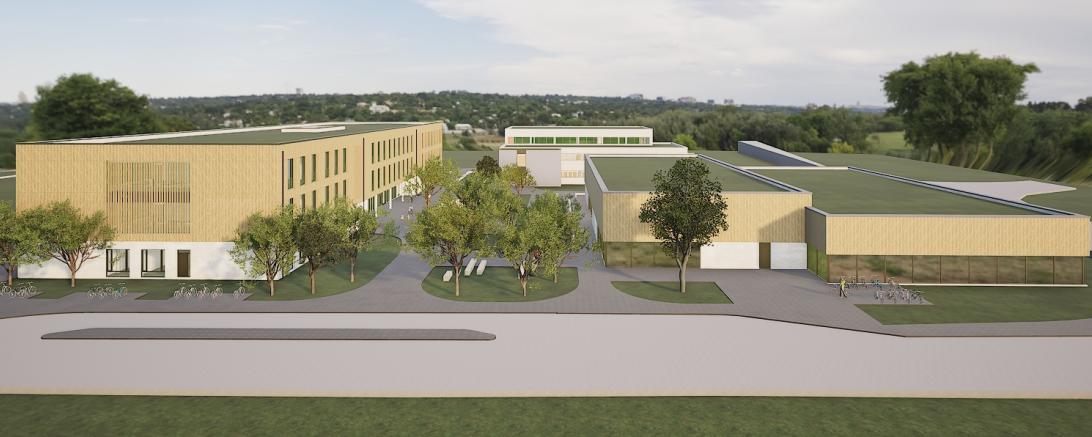 Das ganze Ensemble aus Vogelperspektive von der Josef-Dunau-Straße aus gesehen: das neu Schulgebäude (links), die sanierte Sporthalle (hinten, mitte) und das neue Hallenbad (rechts).  